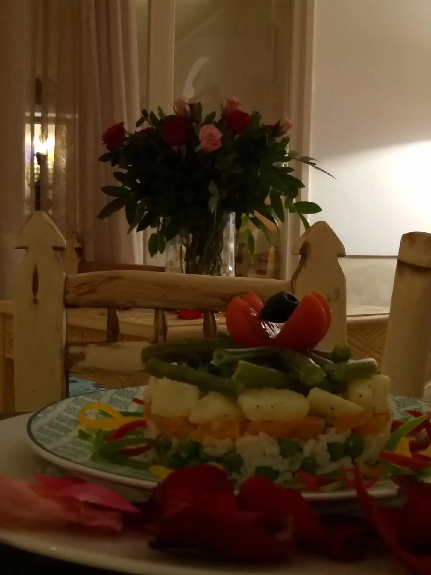 A table set with flowers for dinner in the patio