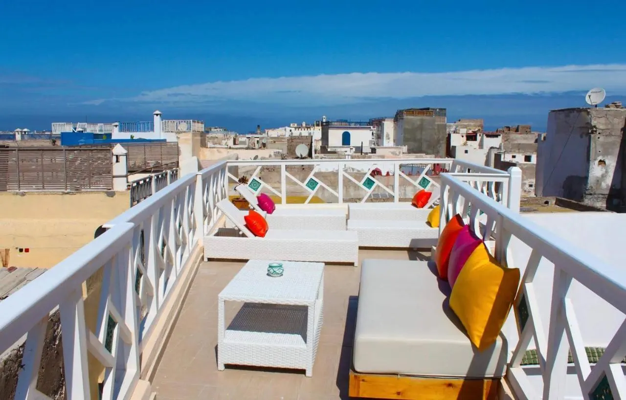 The white rooftop terrace with loungers, over the Essaouira rooftops